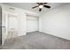 Comfortable bedroom with a ceiling fan and closet space, with entry to the bathroom at 11030 N 47Th Ave, Glendale, AZ 85304
