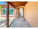 Covered entryway with a security door, a welcome mat, and a peek of the interior at 11030 N 47Th Ave, Glendale, AZ 85304
