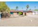Charming single-story home with a spacious front yard and solar panels on the roof at 11030 N 47Th Ave, Glendale, AZ 85304