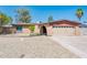 Charming single-story home with a spacious front yard and an attached two-car garage at 11030 N 47Th Ave, Glendale, AZ 85304