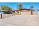 Charming single-story home with a spacious front yard and a two-car garage at 11030 N 47Th Ave, Glendale, AZ 85304