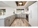 Renovated kitchen features gray cabinets, countertops, and stainless steel appliances at 11030 N 47Th Ave, Glendale, AZ 85304