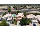Residential neighborhood with backyard pools, mature trees, and paved roads at 111 N Soho Pl, Chandler, AZ 85225