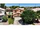 Aerial view of home showcasing a private backyard pool, lush landscaping, and a two-car garage at 111 N Soho Pl, Chandler, AZ 85225