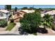 Aerial view shows private backyard, green lawn, landscaping and two-car garage at 111 N Soho Pl, Chandler, AZ 85225