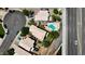 Bird's eye view of residential properties with mature trees near the highway at 111 N Soho Pl, Chandler, AZ 85225