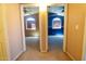 View of two carpeted bedrooms, each with ceiling fans and windows, showcasing the home's layout at 111 N Soho Pl, Chandler, AZ 85225