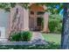 Inviting home entrance featuring a well-manicured lawn and shaded walkway at 111 N Soho Pl, Chandler, AZ 85225