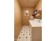 Functional laundry room with washer, dryer, and storage shelves for supplies at 111 N Soho Pl, Chandler, AZ 85225
