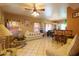 Spacious living room featuring tile floors, ceiling fan, and comfortable seating area at 111 N Soho Pl, Chandler, AZ 85225