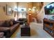 Comfortable living room showcasing neutral color palette, staircase, and large windows at 111 N Soho Pl, Chandler, AZ 85225
