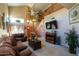 Inviting living room with high ceilings, staircase and plenty of natural light at 111 N Soho Pl, Chandler, AZ 85225