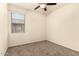 Typical bedroom with carpet, window, ceiling fan, and neutral paint at 11303 E Sunflower Ct, Florence, AZ 85132