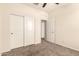 Bedroom featuring closet, access to other rooms, and carpet at 11303 E Sunflower Ct, Florence, AZ 85132
