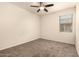 Standard bedroom with carpet, ceiling fan, and a window at 11303 E Sunflower Ct, Florence, AZ 85132