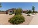 Charming single-story home featuring low-maintenance desert landscaping and a spacious two-car garage at 11303 E Sunflower Ct, Florence, AZ 85132