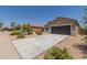 Charming single-story home featuring low-maintenance desert landscaping and a spacious two-car garage at 11303 E Sunflower Ct, Florence, AZ 85132