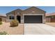 Charming single-story home featuring low-maintenance desert landscaping and a spacious two-car garage at 11303 E Sunflower Ct, Florence, AZ 85132