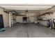 Large garage with storage racks, utility hookups, and an opener at 11303 E Sunflower Ct, Florence, AZ 85132
