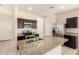 Stylish kitchen with granite countertops, stainless steel appliances, and ample cabinet space at 11303 E Sunflower Ct, Florence, AZ 85132