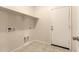 Laundry room with tile floor and access to the outside at 11303 E Sunflower Ct, Florence, AZ 85132