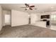 Open-concept living space with neutral carpet adjacent to an eat-in kitchen at 11303 E Sunflower Ct, Florence, AZ 85132