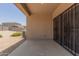 Covered patio with concrete flooring and a security door at 11303 E Sunflower Ct, Florence, AZ 85132