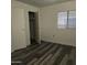 Bedroom featuring new flooring, closet and natural light at 11411 N 91St Ave # 188, Peoria, AZ 85345