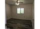 Bedroom featuring light-colored walls, modern flooring and a ceiling fan at 11411 N 91St Ave # 188, Peoria, AZ 85345