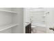 Bright bathroom features granite countertops, shower-tub combo, and convenient storage shelves at 11891 E Cliffrose Ln, Florence, AZ 85132