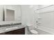 Elegant bathroom with granite countertops, a framed mirror, and shower-tub combination at 11891 E Cliffrose Ln, Florence, AZ 85132