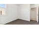 Bright bedroom featuring plush carpeting, fresh neutral paint and natural light, for ultimate relaxation at 11891 E Cliffrose Ln, Florence, AZ 85132