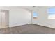 Bright bedroom with carpet, a neutral color scheme, and natural light creates a calm and inviting atmosphere at 11891 E Cliffrose Ln, Florence, AZ 85132