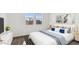 Bright bedroom featuring soft colors, two windows, and coordinated decor, offering a comfortable living space at 11891 E Cliffrose Ln, Florence, AZ 85132