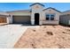Charming single-story home featuring a neutral color palette and a convenient two-car garage at 11891 E Cliffrose Ln, Florence, AZ 85132