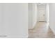 Spacious hallway with tile flooring and neutral walls leads to other areas of the home at 11891 E Cliffrose Ln, Florence, AZ 85132