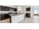 Stylish kitchen with granite countertops, stainless appliances, dark cabinets, and a pantry for efficient storage and meal prep at 11891 E Cliffrose Ln, Florence, AZ 85132