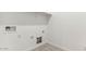 Empty utility room with baseboards, an outlet, and a wall with water hook-ups at 11891 E Cliffrose Ln, Florence, AZ 85132