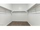 Spacious walk-in closet with ample storage and adjustable shelving, offering a perfect solution for organization at 11891 E Cliffrose Ln, Florence, AZ 85132