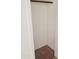A simple closet with a rod for hanging clothes at 11936 W Charter Oak Rd, El Mirage, AZ 85335