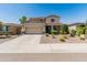 Charming two-story home with a well-manicured lawn and a two-car garage on a sunny day at 12236 W Country Club Ct, Sun City, AZ 85373