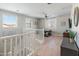 Open loft space with a ceiling fan, natural light, and a cozy spot for work or relaxation at 12236 W Country Club Ct, Sun City, AZ 85373