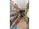 Walk-in pantry with ample shelving and storage for an organized kitchen at 12236 W Country Club Ct, Sun City, AZ 85373