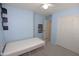 Cozy bedroom with a single bed, carpeted flooring, and ample closet space at 14861 W Ashland Ave, Goodyear, AZ 85395