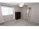Neutral bedroom with carpet, a ceiling fan, and a dark wood dresser at 14861 W Ashland Ave, Goodyear, AZ 85395