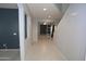 Inviting entryway with neutral paint and modern tile flooring, leading into the bright, open living spaces at 14861 W Ashland Ave, Goodyear, AZ 85395