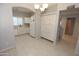 Open kitchen with white cabinets, modern appliances, spacious countertops, and stylish tile flooring for easy maintenance at 14861 W Ashland Ave, Goodyear, AZ 85395