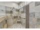 The main bathroom features a walk-in shower with decorative tile and glass enclosure at 15532 W Prairie Dunes Dr, Surprise, AZ 85374
