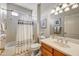 Well-maintained bathroom featuring a shower and tub combination, vanity, and decorative accents creating a welcoming space at 15532 W Prairie Dunes Dr, Surprise, AZ 85374
