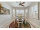 Bright breakfast nook with bay windows offering a picturesque view, ideal for morning coffee at 15532 W Prairie Dunes Dr, Surprise, AZ 85374